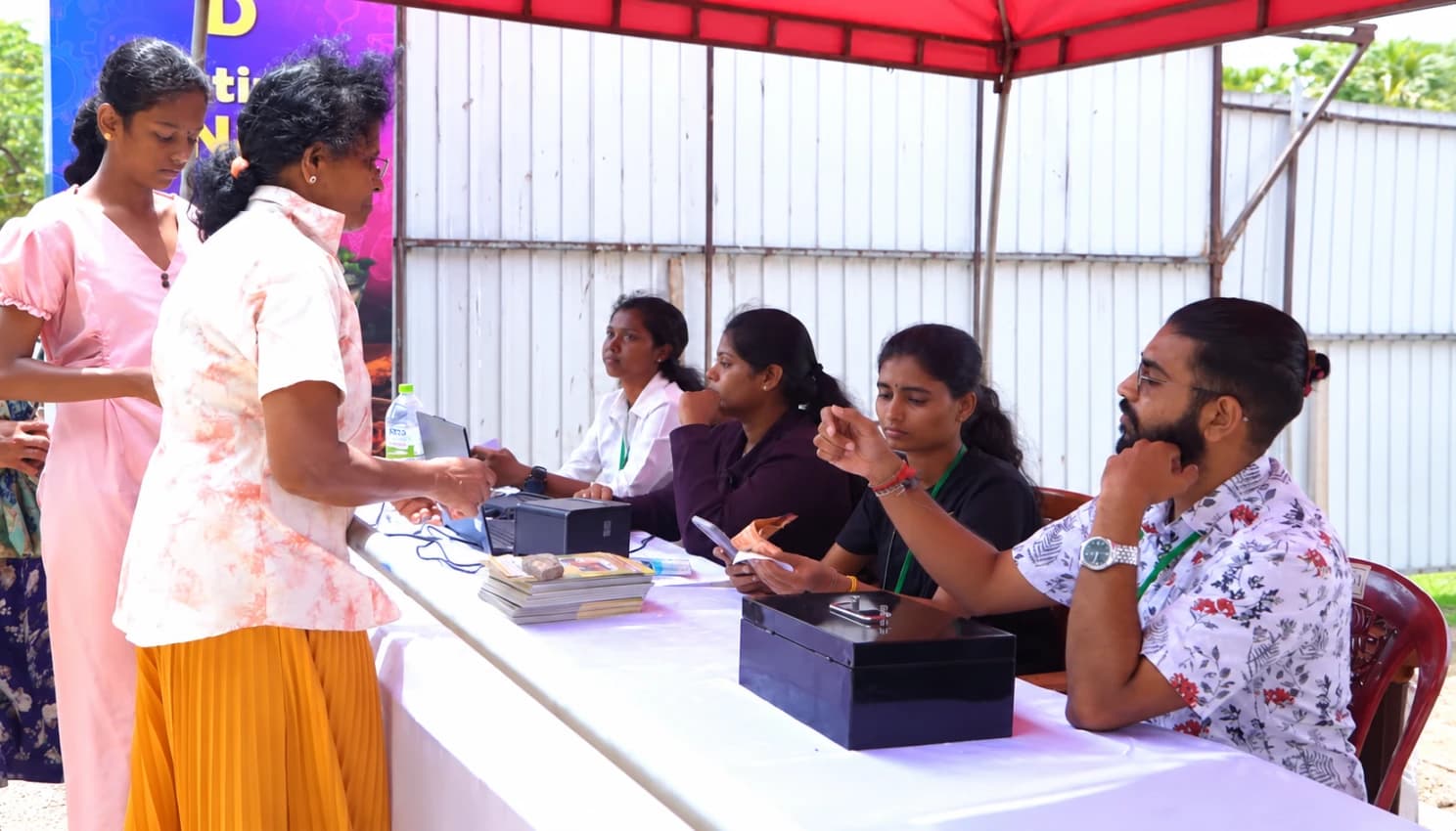 Visitors at the NITE ticket counter, where the team issues QR tickets to walk-ups